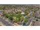 A high-angle shot of a suburban community, highlighting neat residences, mature trees, and a centrally located green park at 2146 W Ian Dr, Phoenix, AZ 85041