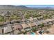 Aerial view of a well-maintained residential area, showcasing lush greenery, manicured lawns, and several homes with sparkling pools at 2146 W Ian Dr, Phoenix, AZ 85041