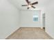 A bedroom featuring a ceiling fan, carpet, natural light, and white walls at 2146 W Ian Dr, Phoenix, AZ 85041