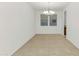 Spacious dining room with tile flooring and a modern chandelier at 2146 W Ian Dr, Phoenix, AZ 85041