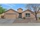 Single-story home with desert landscaping, a two-car garage, and a covered entryway at 2146 W Ian Dr, Phoenix, AZ 85041