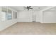 Bright living room with tile floors, ceiling fan, and sunlit windows at 2146 W Ian Dr, Phoenix, AZ 85041