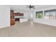 Open-concept living area with kitchen, dining, and abundant natural light from multiple windows at 2146 W Ian Dr, Phoenix, AZ 85041
