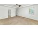 A spacious primary bedroom with a ceiling fan and a window letting in natural light at 2146 W Ian Dr, Phoenix, AZ 85041