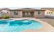 Backyard features a kidney shaped pool with patio area and privacy wall at 2146 W Ian Dr, Phoenix, AZ 85041