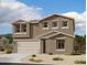 Charming two-story home featuring a two car garage, neutral color palette, and beautiful xeriscaping at 2337 E Homesteader Rd, San Tan Valley, AZ 85140