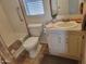 Bathroom with a bath and toilet. Natural light through window blinds at 2460 E Main St # A2, Mesa, AZ 85213