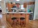 Spacious kitchen featuring a breakfast bar, stainless steel appliances, and ample wooden cabinetry at 2460 E Main St # A2, Mesa, AZ 85213