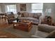 Cozy living room with neutral tones, plush seating, and natural light streaming through the windows at 2460 E Main St # A2, Mesa, AZ 85213
