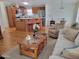 Inviting open-concept living room with laminate flooring, comfortable seating, and a view of the kitchen area at 2460 E Main St # A2, Mesa, AZ 85213
