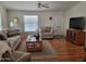 Comfortable living room with hardwood floors, plush seating, and a bright, airy feel at 2460 E Main St # A2, Mesa, AZ 85213