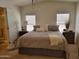 Tranquil main bedroom with a queen-sized bed, soft lighting, and ensuite bathroom for added privacy at 2460 E Main St # A2, Mesa, AZ 85213