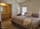 Serene main bedroom featuring a queen-sized bed, ensuite bathroom, and calming neutral decor at 2460 E Main St # A2, Mesa, AZ 85213