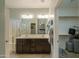 Ensuite bathroom features a double sink vanity, glass enclosed shower, and access to a walk in closet at 2611 E San Simeon Dr, Casa Grande, AZ 85194