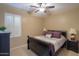 Cozy bedroom with dark furniture, plantation shutters, and neutral walls at 2611 E San Simeon Dr, Casa Grande, AZ 85194