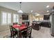 Dining area adjacent to the kitchen features modern lighting and a view into the kitchen at 2611 E San Simeon Dr, Casa Grande, AZ 85194
