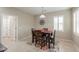 Inviting dining area with wood table, decorative rug, and modern light fixture at 2611 E San Simeon Dr, Casa Grande, AZ 85194