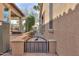 Exterior side view of the home with gated access to the backyard patio at 2611 E San Simeon Dr, Casa Grande, AZ 85194