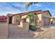 Attractive single-story house with tile roof, brick pavers, and manicured desert landscaping at 2611 E San Simeon Dr, Casa Grande, AZ 85194