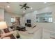 Inviting living room with neutral walls, tile floors, comfortable seating, and a ceiling fan at 2611 E San Simeon Dr, Casa Grande, AZ 85194