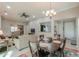 Spacious living area with comfortable seating, an entertainment center, and a connecting dining space at 2611 E San Simeon Dr, Casa Grande, AZ 85194