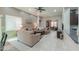Open living area with comfortable seating, abundant natural light and view into office area at 2611 E San Simeon Dr, Casa Grande, AZ 85194