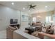 Bright living room featuring neutral tones, recessed lighting, and a ceiling fan at 2611 E San Simeon Dr, Casa Grande, AZ 85194