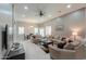Spacious living room with recessed lights, ceiling fan, and large windows with shutters at 2611 E San Simeon Dr, Casa Grande, AZ 85194