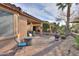 Brick paved patio featuring an outdoor seating area and lush desert landscaping at 2611 E San Simeon Dr, Casa Grande, AZ 85194