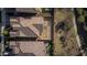 An overhead view of multiple rooftops and backyards in a residential area at 26844 N 73Rd Dr, Peoria, AZ 85383