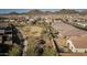 Aerial view of backyards in a residential community, lined by sidewalks and desert foliage at 26844 N 73Rd Dr, Peoria, AZ 85383