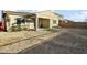 View of covered patio and expansive backyard ready for landscaping, perfect for outdoor living and entertaining at 26844 N 73Rd Dr, Peoria, AZ 85383