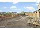 Spacious backyard with a retaining wall, offering potential for landscaping and outdoor living customization at 26844 N 73Rd Dr, Peoria, AZ 85383