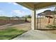 Large backyard with an outdoor living space, covered patio and potential for landscaping and customization at 26844 N 73Rd Dr, Peoria, AZ 85383