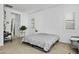 Bright bedroom featuring neutral tones, modern furnishings, and ample natural light from the shuttered windows at 26844 N 73Rd Dr, Peoria, AZ 85383