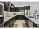 Kitchen with white countertops, dark wood cabinets, stainless steel appliances at 26844 N 73Rd Dr, Peoria, AZ 85383