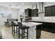 Eat-in kitchen with stainless steel appliances and dark wood cabinets at 26844 N 73Rd Dr, Peoria, AZ 85383