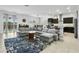 Open-concept living area with tile floors flows to the kitchen and dining space at 26844 N 73Rd Dr, Peoria, AZ 85383