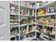 Organized pantry with white shelving, maximizing storage for food items and household supplies at 26844 N 73Rd Dr, Peoria, AZ 85383