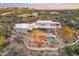 Expansive aerial view showcasing the outdoor living space, pool, and natural desert landscaping of the estate at 30600 N Pima Rd # 76, Scottsdale, AZ 85266