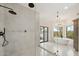 Modern bathroom features a glass shower, double vanity, soaking tub, and natural light at 30600 N Pima Rd # 76, Scottsdale, AZ 85266