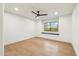 This bedroom has hardwood floors, neutral walls, recessed lighting, and a window seat at 30600 N Pima Rd # 76, Scottsdale, AZ 85266