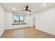 This bedroom has hardwood floors, neutral walls, recessed lighting, and a window seat with closet access at 30600 N Pima Rd # 76, Scottsdale, AZ 85266