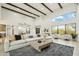 Spacious living room with soaring ceilings, wood beam accents, and an abundance of natural light at 30600 N Pima Rd # 76, Scottsdale, AZ 85266