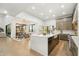 Open-concept kitchen and living room boasts high ceilings, large windows, and contemporary decor at 30600 N Pima Rd # 76, Scottsdale, AZ 85266