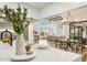 Open-concept kitchen and living room boasts high ceilings, large windows, and contemporary decor at 30600 N Pima Rd # 76, Scottsdale, AZ 85266
