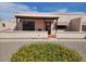 Charming single-story home with well-maintained landscaping and inviting front entrance at 311 E Lancaster Ct, Florence, AZ 85132