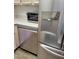 Modern kitchen featuring stainless steel appliances, sleek countertops, and ample storage at 311 E Lancaster Ct, Florence, AZ 85132