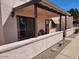 Relaxing covered patio with sliding glass doors, offering an outdoor living space at 311 E Lancaster Ct, Florence, AZ 85132