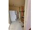 Utility room with water heater, shelving, and room for storage at 311 E Lancaster Ct, Florence, AZ 85132